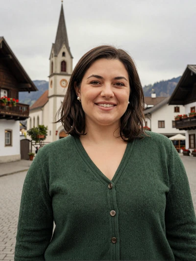 Katharina, 33, a brunette Liechtenstein woman in the village square of Mauren with a church steeple