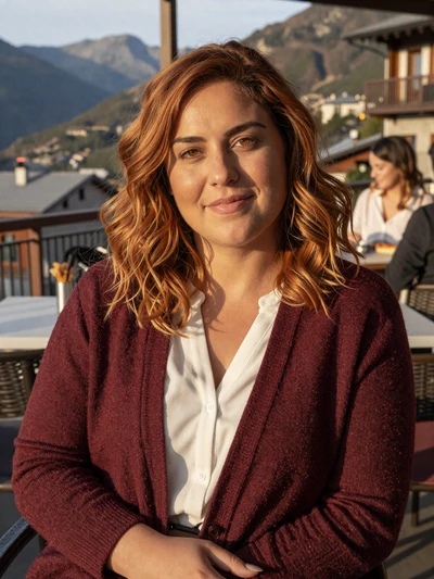 Carme, 30, an auburn-haired Andorran woman at a mountain terrace in La Massana