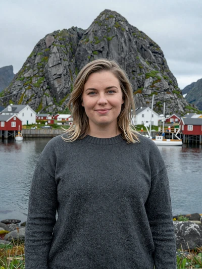 Elín, 29, a dark blonde Icelandic woman in lopapeysa sweater at Ísafjörður fishing harbor