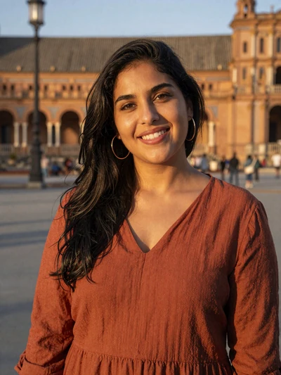 Marta, 27, a vibrant Spanish woman on a sunlit Madrid plaza
