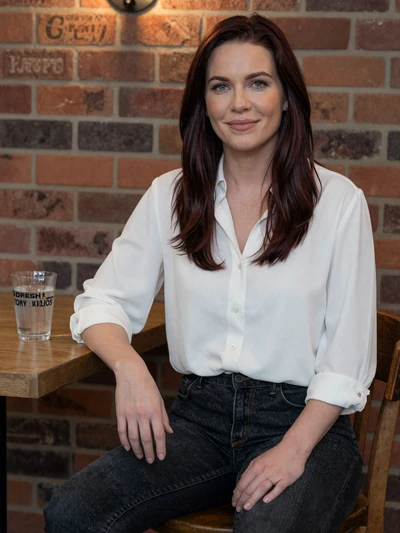 Charlotte, 30, an auburn-haired British woman at a cozy Manchester cafe