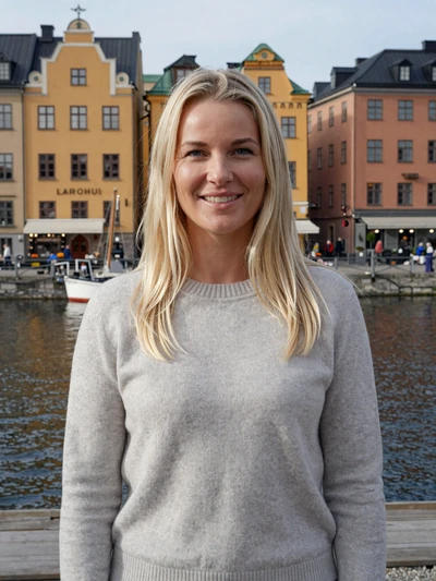 Elsa, 30, a smiling Swedish woman on Stockholm waterfront