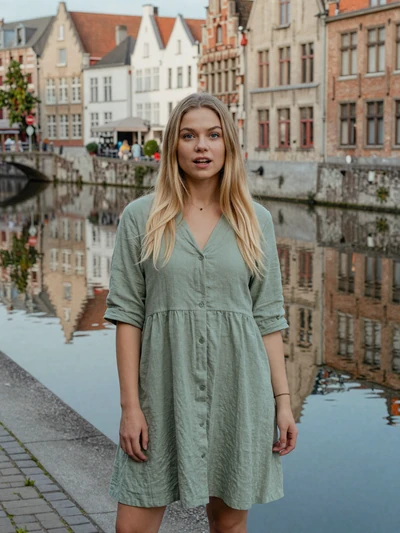 Amélie, 26, a blonde Belgian woman by the Ghent canal with medieval architecture