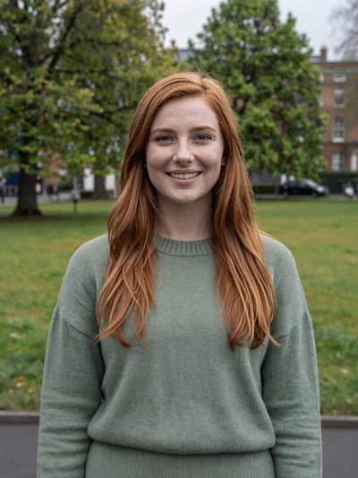 Siobhan, 29, Irish woman with auburn hair smiling in a green Dublin park