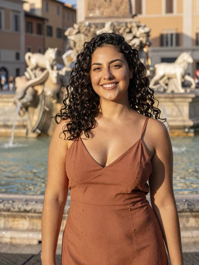 Valentina, 27, a radiant Italian woman on a Rome piazza illustrating Italian dating passion