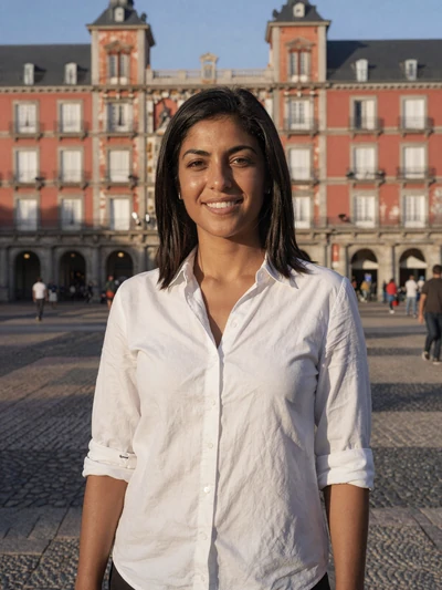 María, 30, a confident Spanish woman at a sunny Madrid plaza